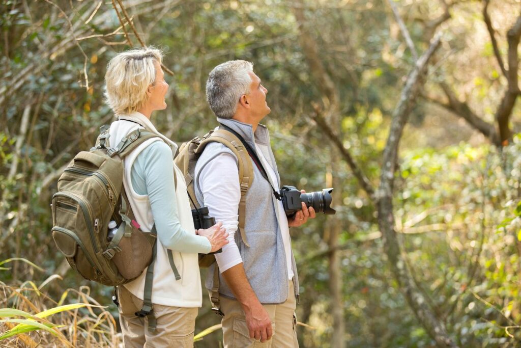 an older couple birdwatching