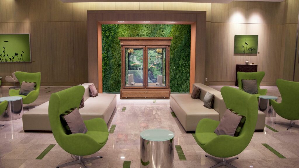 aviary in a hotel lobby with nature-focused decor