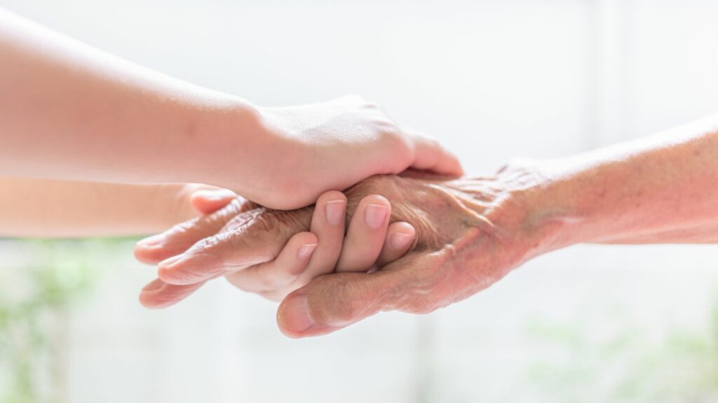 sensory activities for dementia patients by holding and massaging hands