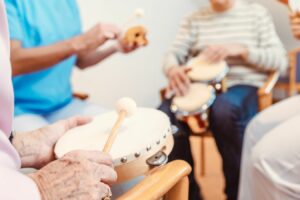 group playing the drums in an assisted living community