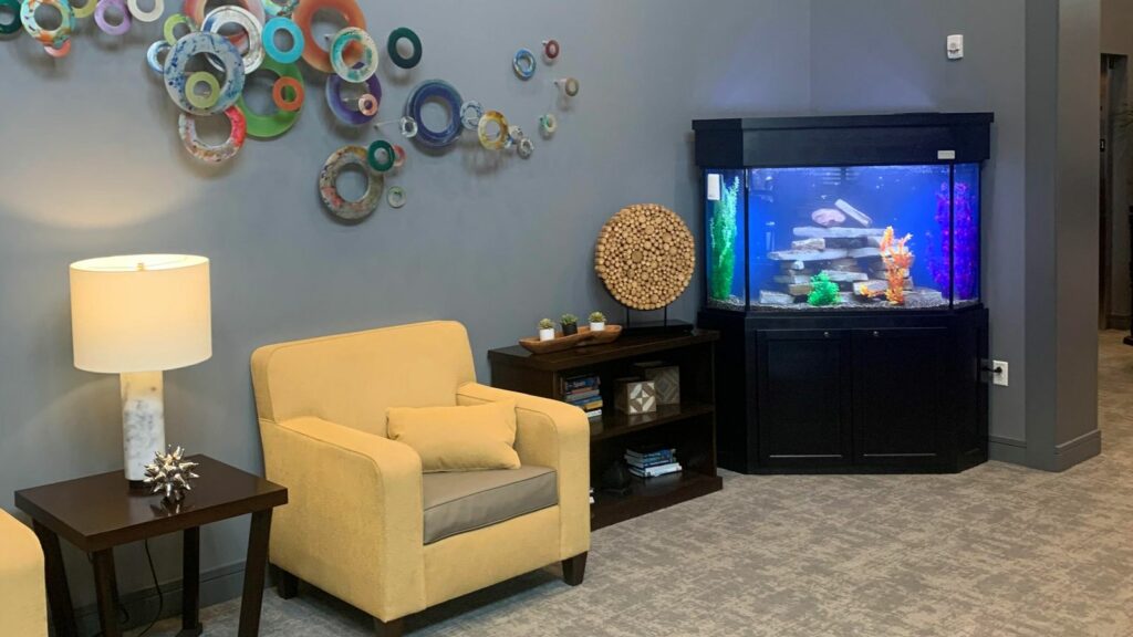 corner of a waiting room with wall decor and comforting decorative accents