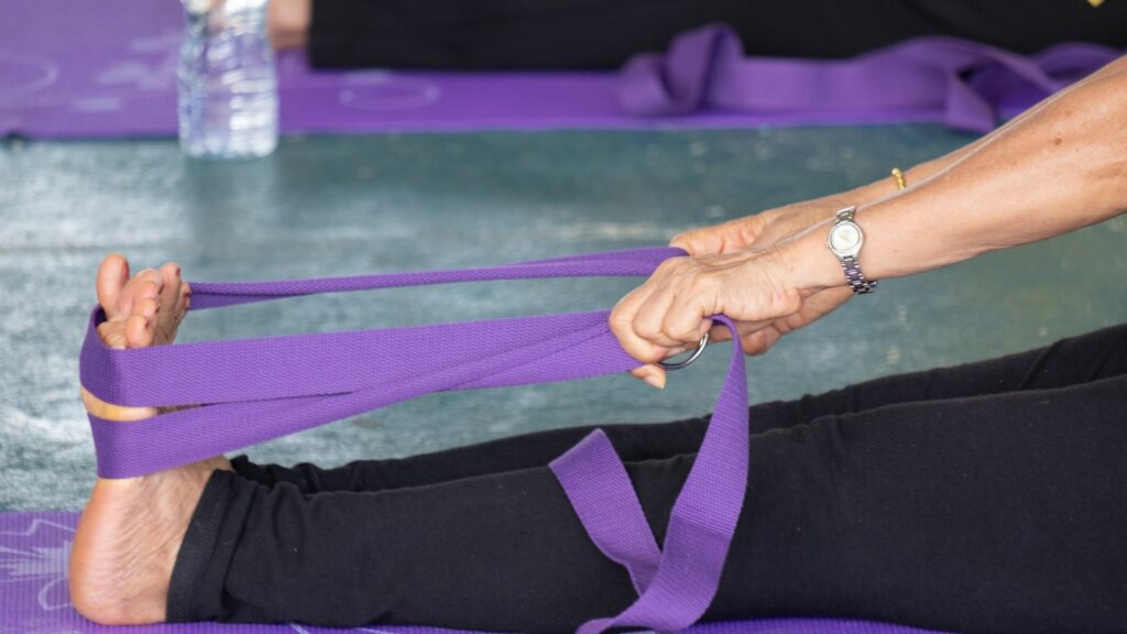 woman using a band to stretch