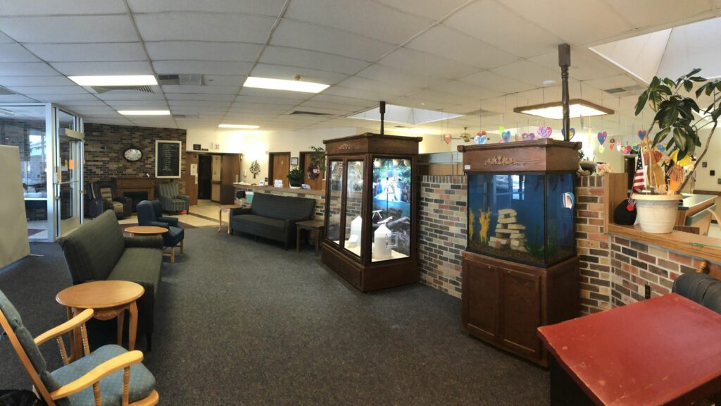 spacious waiting room with a serenity aquarium and a serenity aviary