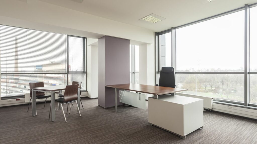 large windows in a corner office